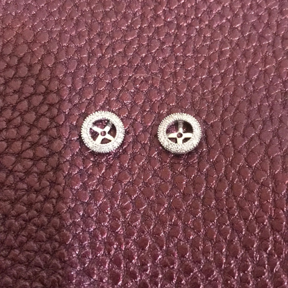 Diamond and white gold earring jackets.